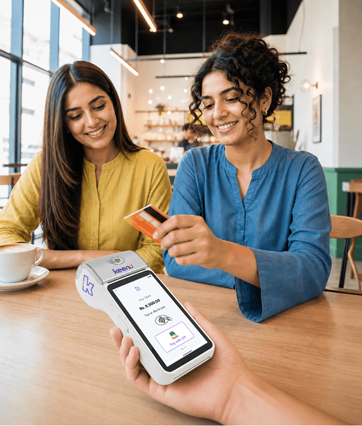 Keenu POS terminal and card machine running at a busy restaurant counter
