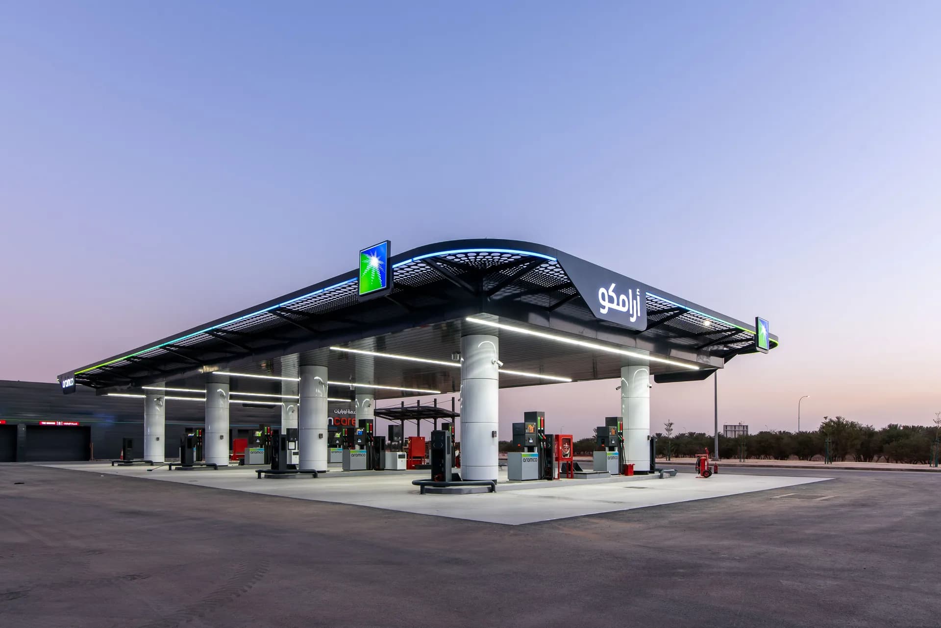 A fuel station forecourt at twilight